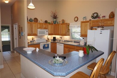 Kitchen with large center island make this house g