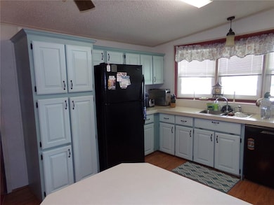 Another shot of Kitchen showing more cabinets