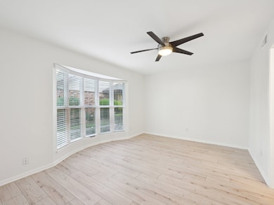 The downstairs Primary Bedroom has a beautiful bay