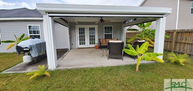 A view of rear porch showing additional grilling a