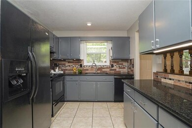Kitchen with granite counters.