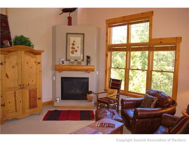 Living Room. Relax around the fireplace after a da