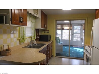 Kitchen opens to enclosed porch
