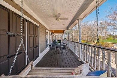 Wooden deck featuring a porch and a ceiling fan