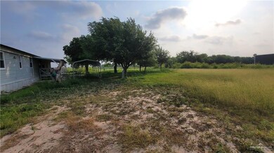 View of yard with a detached carport