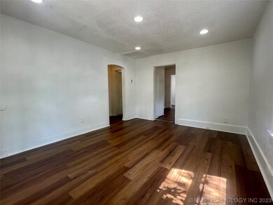 Livingroom connects to hallway and the kitchen