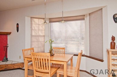 Elegant bay window in dining area lends a hand to 