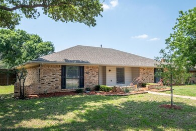 Ranch-style house featuring a front yard