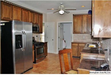 The kitchen has a arge laundry room adjacent.
