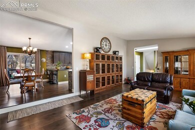Living room opens to dining and kitchen