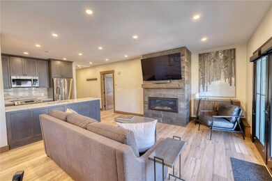 Living room with a fireplace and lvp flooring