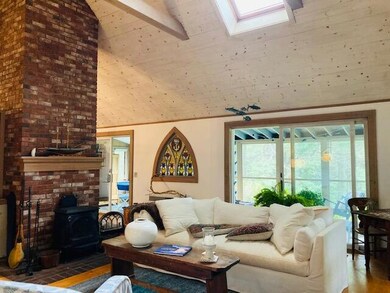Wood stove chimney in great room.