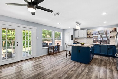 Kitchen, breakfast room and den are open.  Kitchen was remodeled after the winter storm 2021, new floors were added, windows and French doors were replaced at that time.