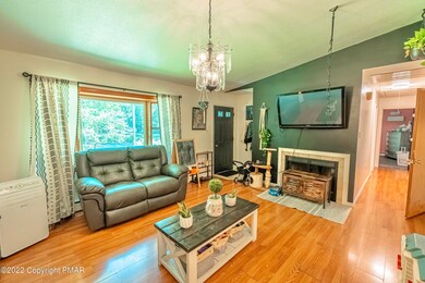 Living Room w/ FP & Front Entrance