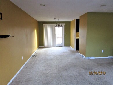 OPEN LIVING/DINING AREA WITH SLIDERS TO BACK DECK