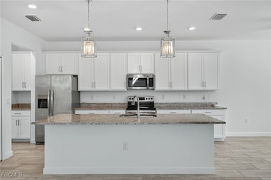 11484 Canopy Loop, Miromar Lakes, FL 33913 - photo 3