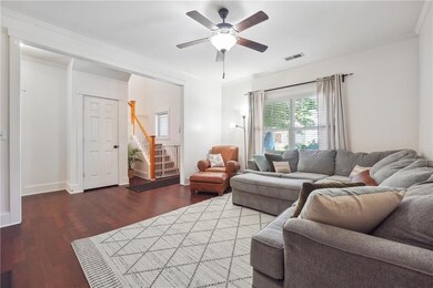 Living room with ceiling fan, dark hardwood / wood