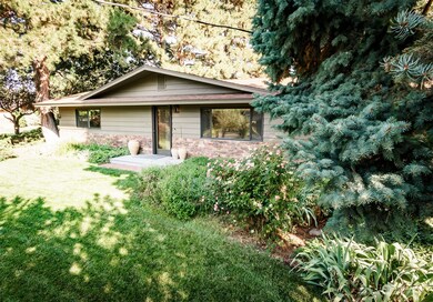 Manicured lawn includes sprinkler system for easier maintenance