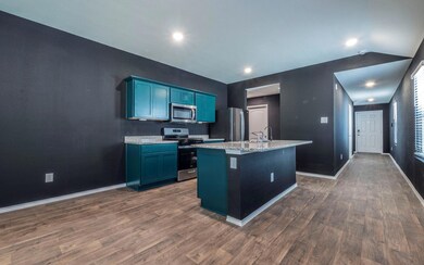Kitchen featuring appliances with stainless steel