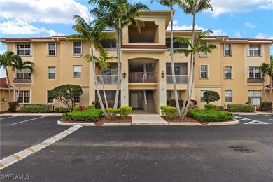 View of property featuring uncovered parking