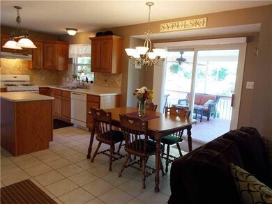 Kitchen. Ceramic floor and back splash open to fam