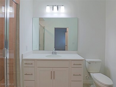 Full bathroom featuring vanity and a shower stall