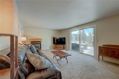 Large living room with sliding doors to deck and lake views