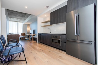 Kitchen featuring appliances with stainless steel