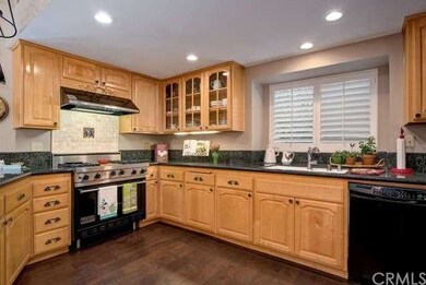 Remodeled and expanded kitchen with granite counte