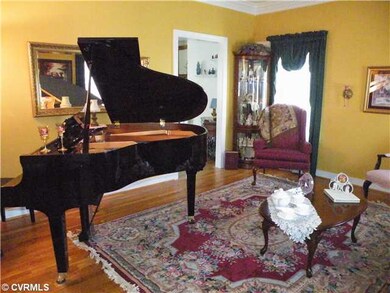 Living Room - Formal living room offers hardwood f