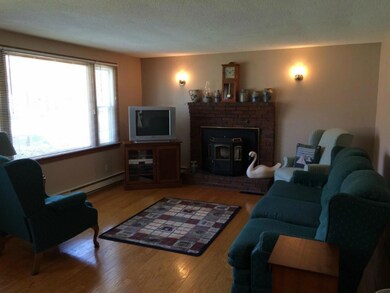 The brick fire place presently has a...