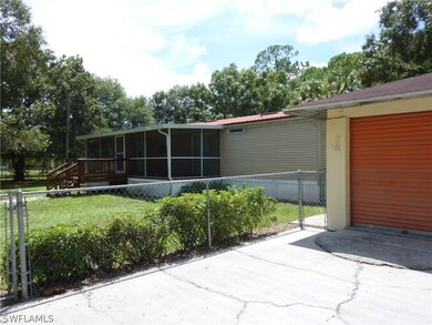 Manufactured Double Wide Fenced in Yard with Large Entry Porch