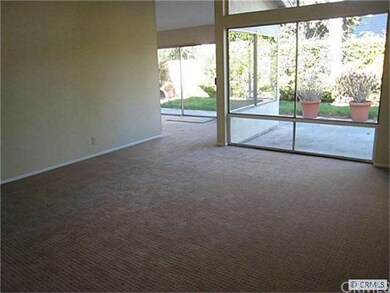 Luxurious living room is adjacent to formal dining
