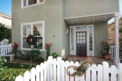 Front yard has beautiful rose garden, brick porch 
