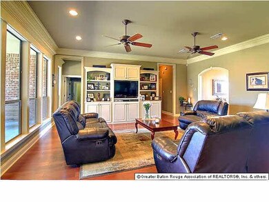 Living Room with double ceiling fans, beautiful cr