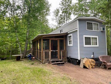 Rear view of house with a sunroom