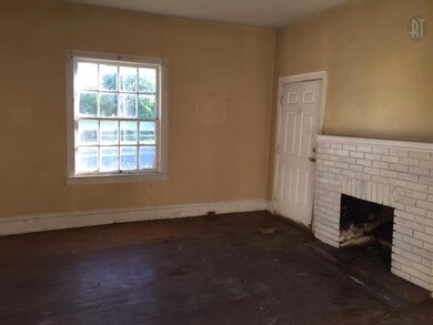 Downstairs bedroom 1 with hardwood floors