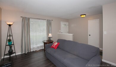 Formal living area off entry with new flooring and