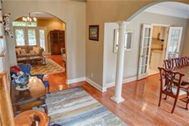 Front door entry into the foyer with open view of 