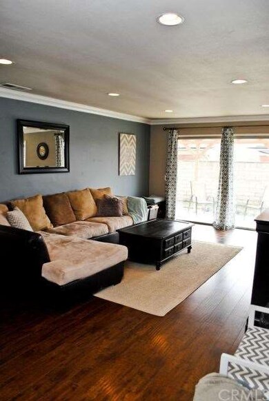 Consistent flooring in living room, dining room, k