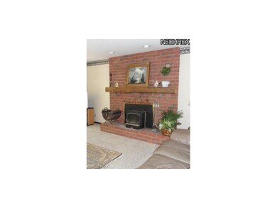 Striking fireplace is focal point of room.