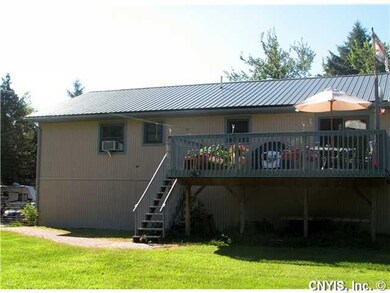 Exterior Back. Great deck overlooking fenced yard 