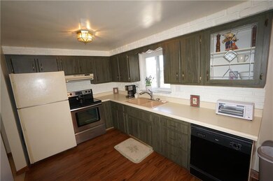 formica wood look cabinets and laminate floor....