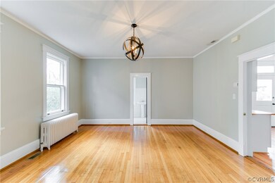 This spacious dining room features direct access to the kitchen for easy entertaining, as well as the downstairs full bath.