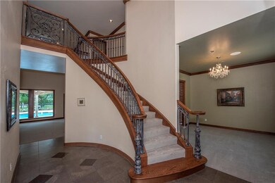 Impressive vaulted entry with circular staircase