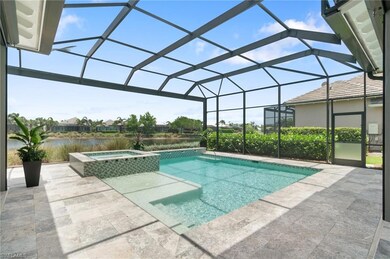 Custom pool and spa with travertine paved lanai
