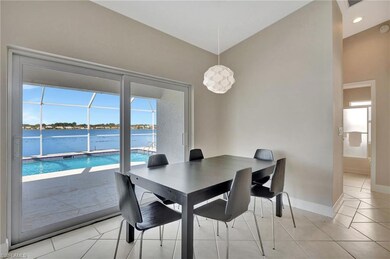 Tiled dining space featuring plenty of natural lig