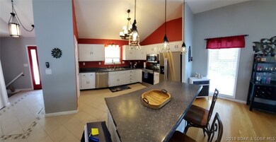 Tiled entry/kitchen, open floor plan.