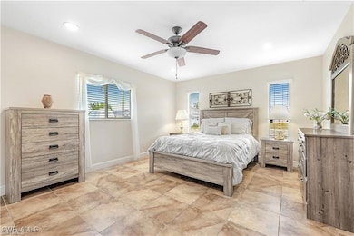 Bedroom featuring a ceiling fan and recessed light