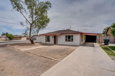 Front w/ HUGE Carport